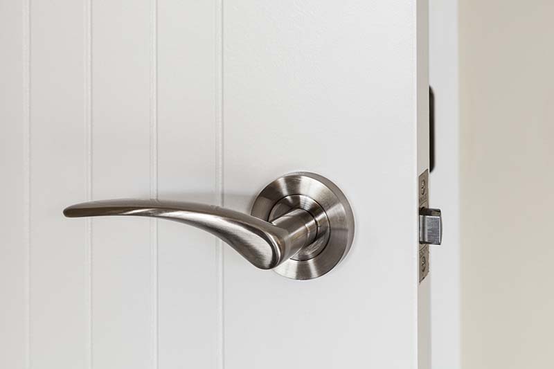 Internal door handle or lever set on white door